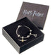 Bracelet charms argent Harry Potter avec pendentif Vif d'Or et Reliques de la Mort sur fond blanc