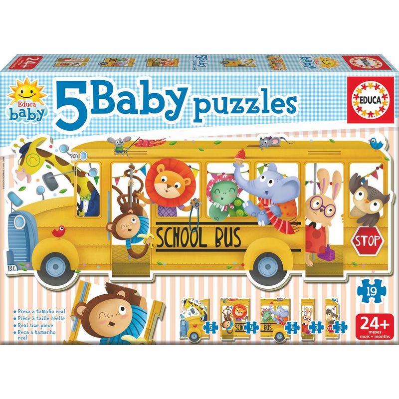 Enfant jouant avec le puzzle bus scolaire EDUCA BORRAS sur une table lumineuse
