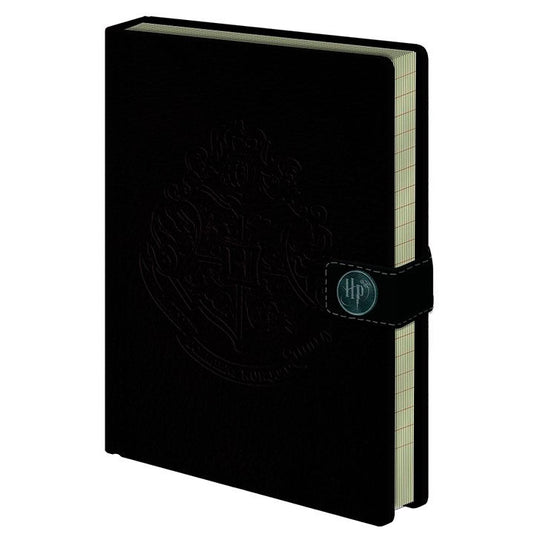Cahier A5 Harry Potter Hogwarts de marque PYRAMID avec couverture illustrée, format 15x21 cm.