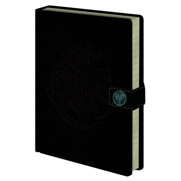 Cahier A5 Harry Potter Hogwarts de marque PYRAMID avec couverture illustrée, format 15x21 cm.