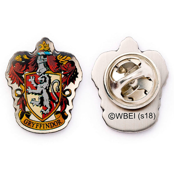 Pin's Harry Potter représentant le blason rouge et or de la maison Gryffindor, signé THE CARAT SHOP, avec détails précis et finition soignée.