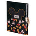Vue rapprochée de la clé métallique attachée au carnet secret Disney Mickey