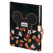 Vue rapprochée de la clé métallique attachée au carnet secret Disney Mickey