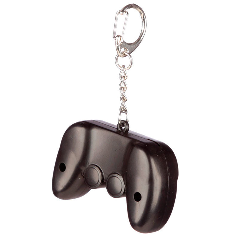Porte-clés Game Over PUCKATOR avec éclairage LED activé sur fond blanc