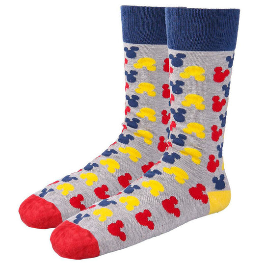 Chaussette Disney Mickey avec visage souriant de Mickey sur fond blanc, détail de la texture en coton doux