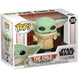 Détail de la figurine Funko POP Baby Yoda The Child avec sa tête verte et ses grands yeux expressifs