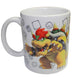 Set complet avec mug Bowser et tirelire métallique posés sur une surface blanche