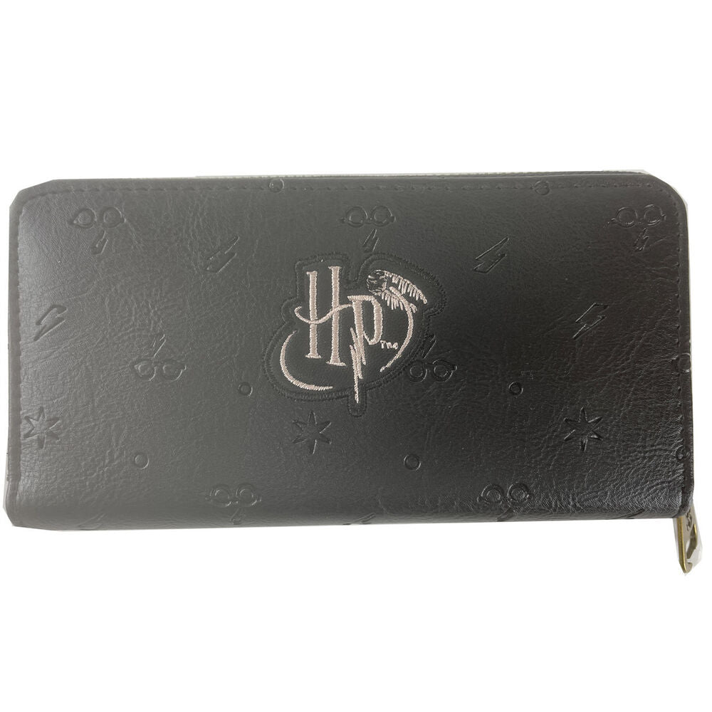 Portefeuille Harry Potter Wings ouvert montrant la poche centrale zippée et les compartiments pour billets