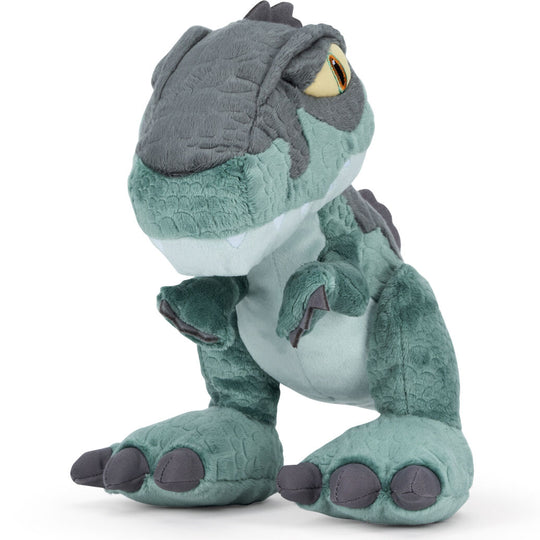 Peluche Jurassic World 25cm posée sur un fond neutre mettant en valeur ses dimensions