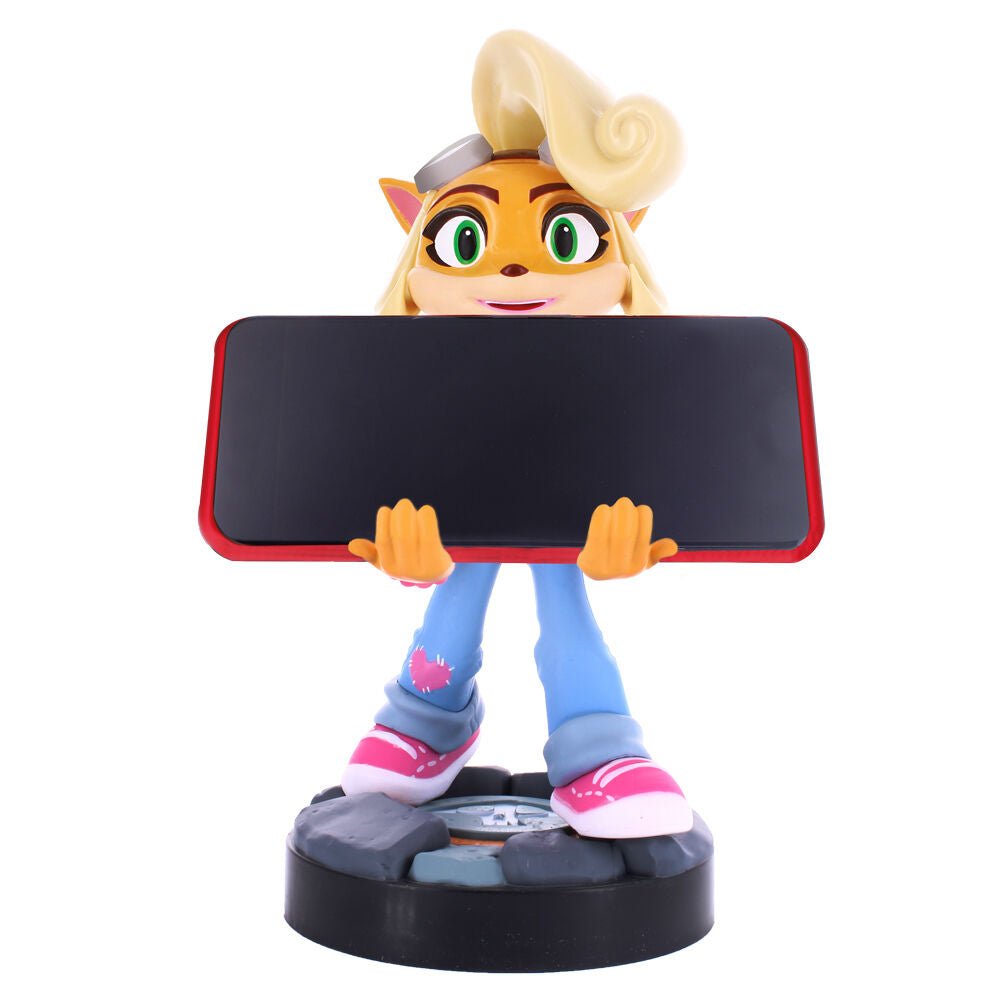 Support Coco tenant une manette de jeu et un smartphone en position stable sur bureau