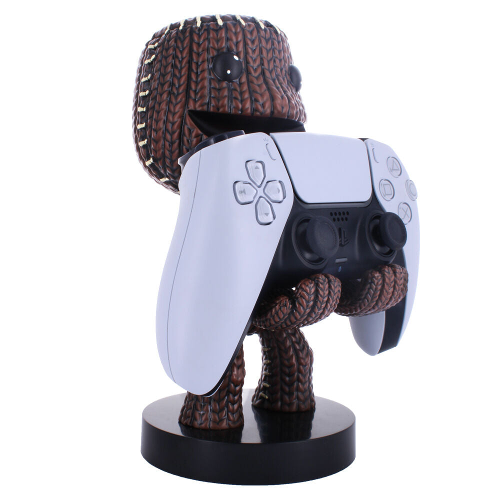 Support Cable Guy Sackboy avec un smartphone posé, illustrant la compatibilité avec les iPhones récents