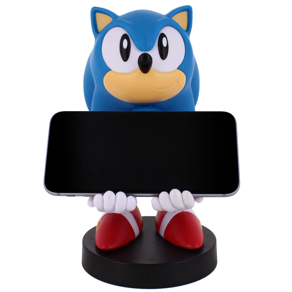 Présentation du support Cable Guy Sonic 30th Anniversary avec un iPhone posé, démontrant la compatibilité smartphone