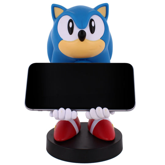 Présentation du support Cable Guy Sonic 30th Anniversary avec un iPhone posé, démontrant la compatibilité smartphone