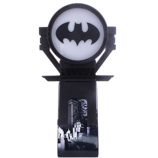 Vue latérale du support Cable Guy Batman avec manette PS5 posée sur le plateau rotatif R.E.S.T.
