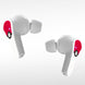Présentation des écouteurs Pokémon Pokeball posés à côté de la boîte de vente montrant le packaging complet