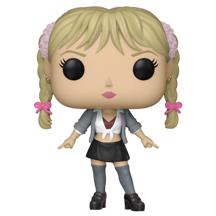 Set complet avec figurine POP posée à côté du t-shirt plié sur fond neutre