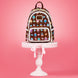 Photo du sac à dos Loungefly Disney Princess Cakes porté par une personne en extérieur