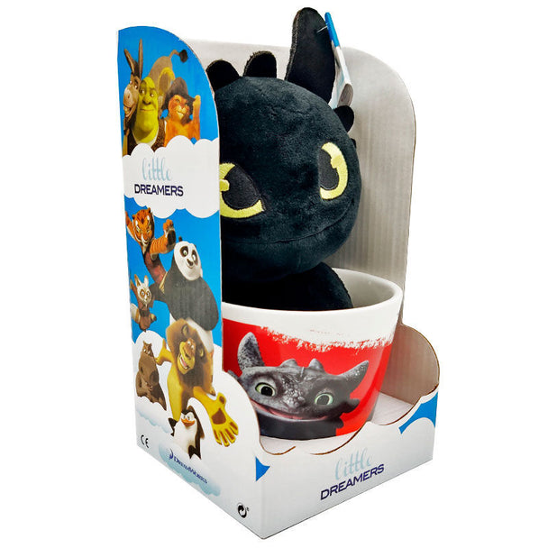 Peluche Toothless douce et détaillée de 18 cm, posée à côté du mug officiel DREAMWORKS.