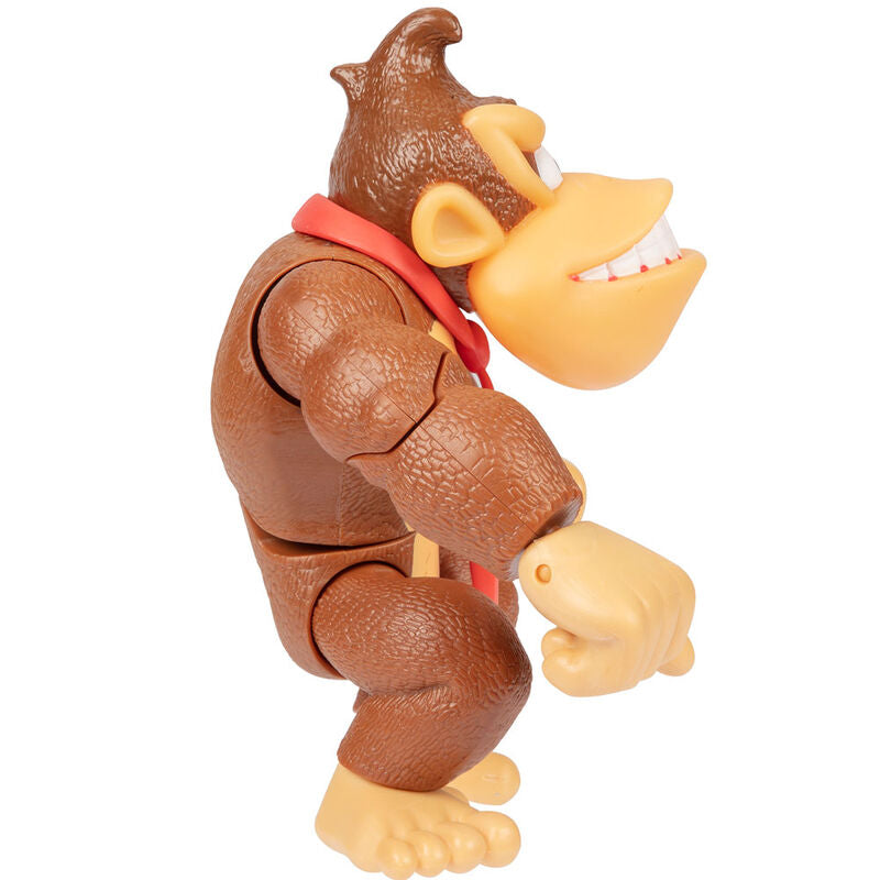 Comparaison de la taille de la figurine Donkey Kong avec un objet de référence pour évaluer l'échelle