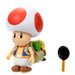 Gros plan sur le visage souriant de la figurine Toad Super Mario Bros