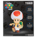 Image de la figurine Toad avec un fond flou mettant en valeur les détails du personnage