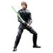 Image de la figurine Luke Skywalker et Grogu posée sur un socle décoratif Star Wars