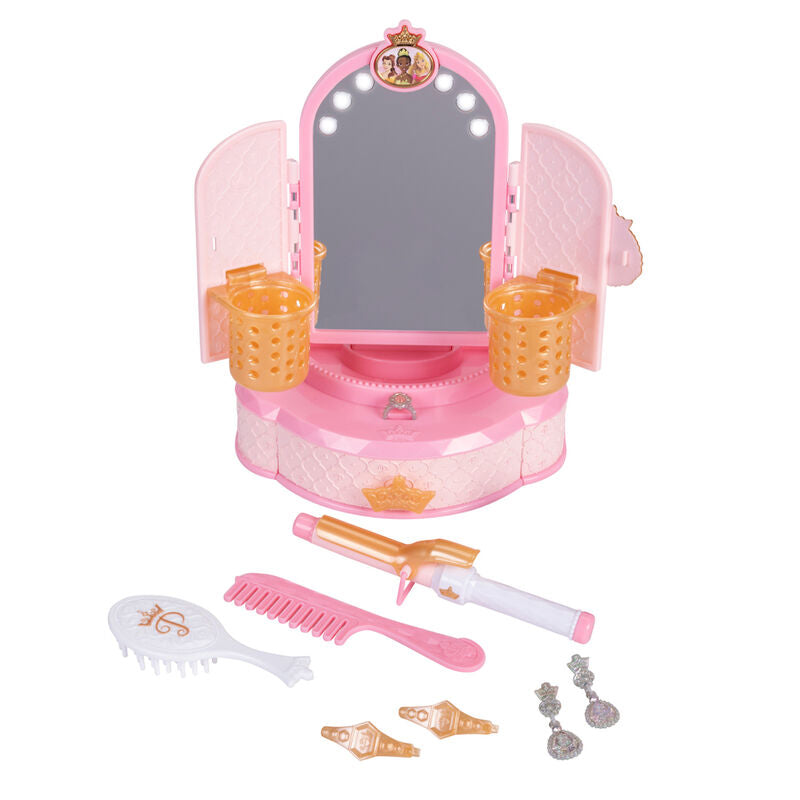 Miroir de maquillage posé sur une table, décoré avec des images des princesses Disney