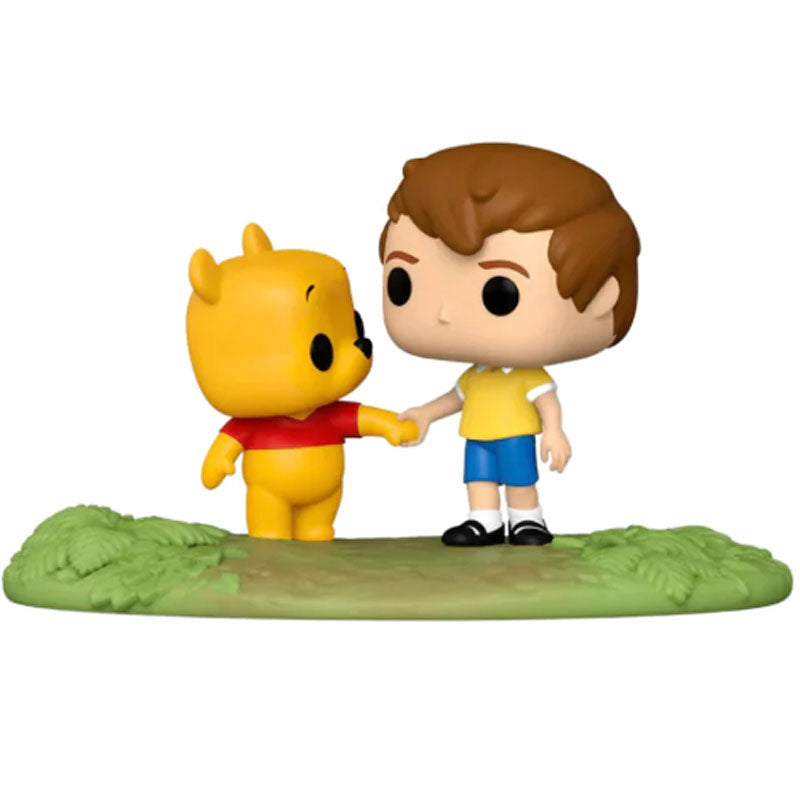 Figurine POP Disney exclusive montrant Winnie l'Ourson assis avec Christopher Robin souriant à ses côtés