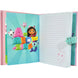 Journal secret sonore Gabbys Dollhouse posé sur une table avec accessoires d'écriture