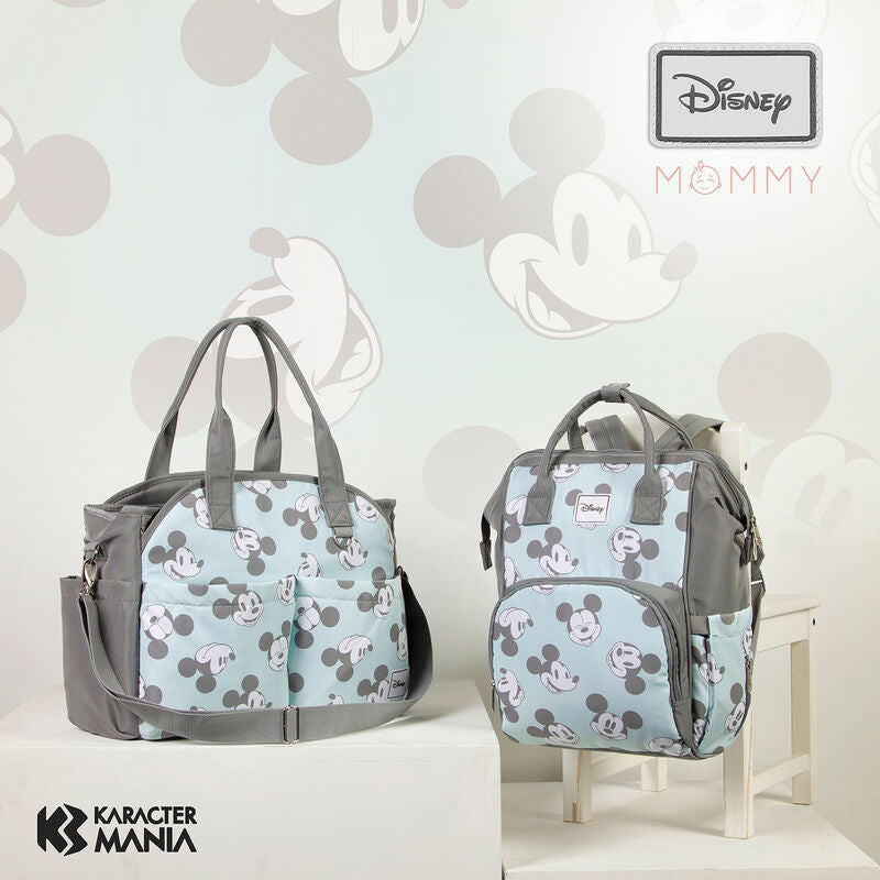 Deux poignées du sac Disney Mickey permettant de le suspendre sur une barre de chariot