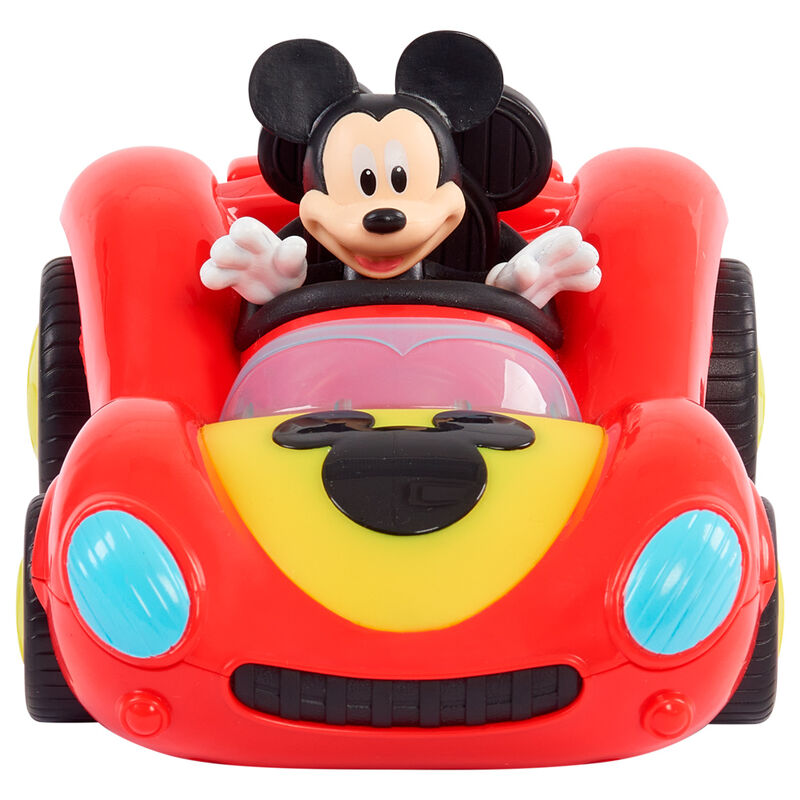 Mickey au volant de son véhicule, prêt à s'amuser dans un décor lumineux