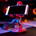 Présentation du support Cable Guy avec manette et smartphone en charge