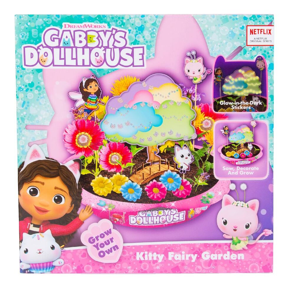 Enfant jouant avec le set de jardinage Gabbys Dolls House dans un environnement ludique