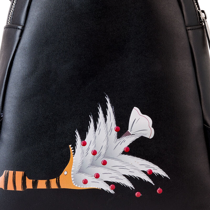 Détail des appliqués et des éléments qui brillent dans le noir sur le sac à dos Disney Loungefly