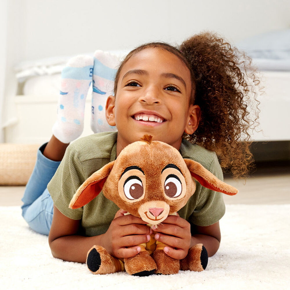 Profil latéral de la peluche Disney Wish Valentino montrant la texture