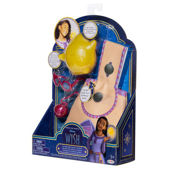 Enfant jouant avec l'étoile lumineuse Disney Wish et le sac à dos assorti