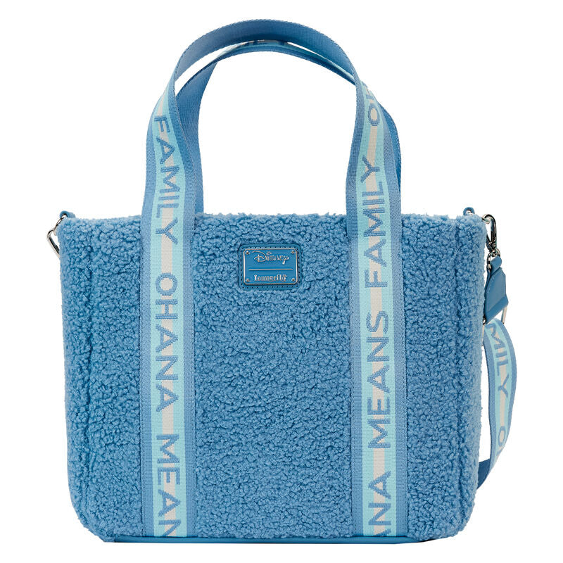 Côté du sac montrant les poches latérales pratiques et la texture en cuir vegan et peluche