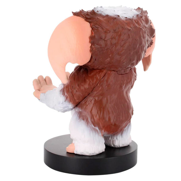 Détail du support Gremlins Gizmo tenant une manette Xbox Series S avec smartphone à côté