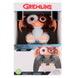 Gros plan sur la fixation sécurisée du support Gremlins Gizmo pour manettes de jeu