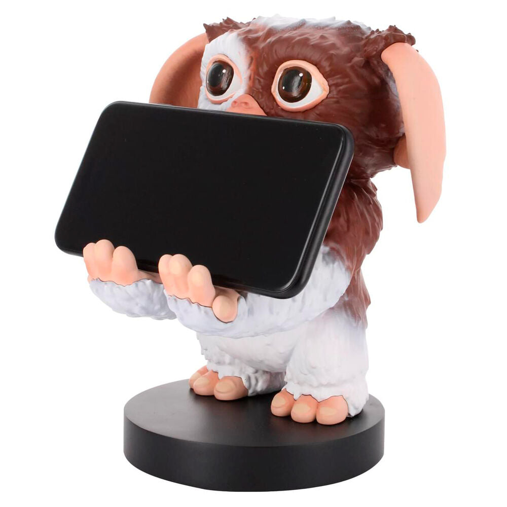 Support Gremlins Gizmo installé sur un bureau de gaming avec console et accessoires