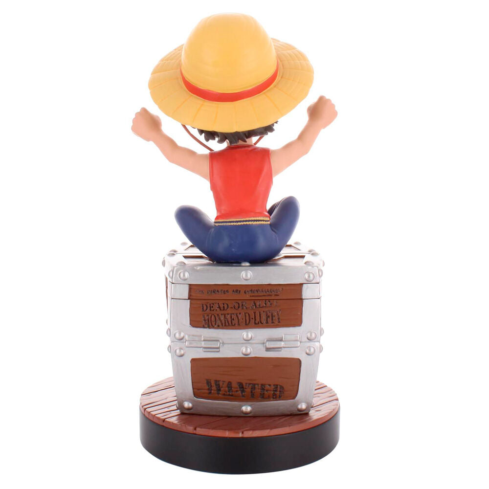 Support Cable Guy Luffy tenant une manette noire sur fond de console de jeu
