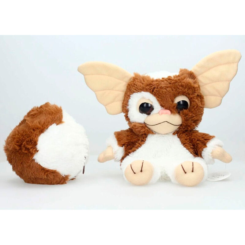 Gros plan sur le visage expressif de la peluche Gizmo Gremlins SD TOYS avec ses grands yeux marron