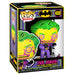 T-shirt Joker plié à côté de la figurine Funko POP pour illustrer le pack complet