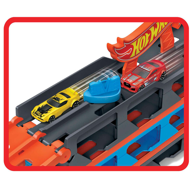 Compartiments de rangement sous la piste pour stocker jusqu'à 25 véhicules Hot Wheels