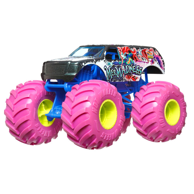 Hot Wheels Monster Truck jaune en action sur un circuit de jeu miniature.