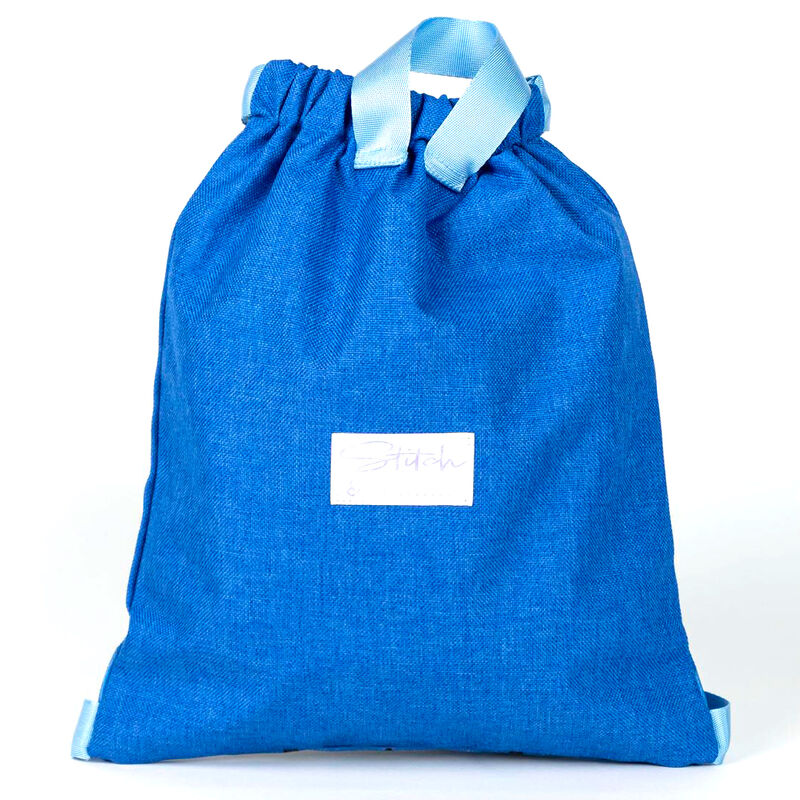 Détail du tissu polyester résistant et des finitions du sac Disney Stitch 33cm