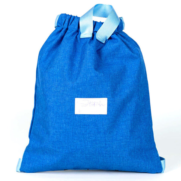 Détail du tissu polyester résistant et des finitions du sac Disney Stitch 33cm