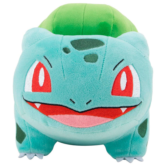 Gros plan sur le visage souriant de la peluche Bulbizarre officielle JAZWARES