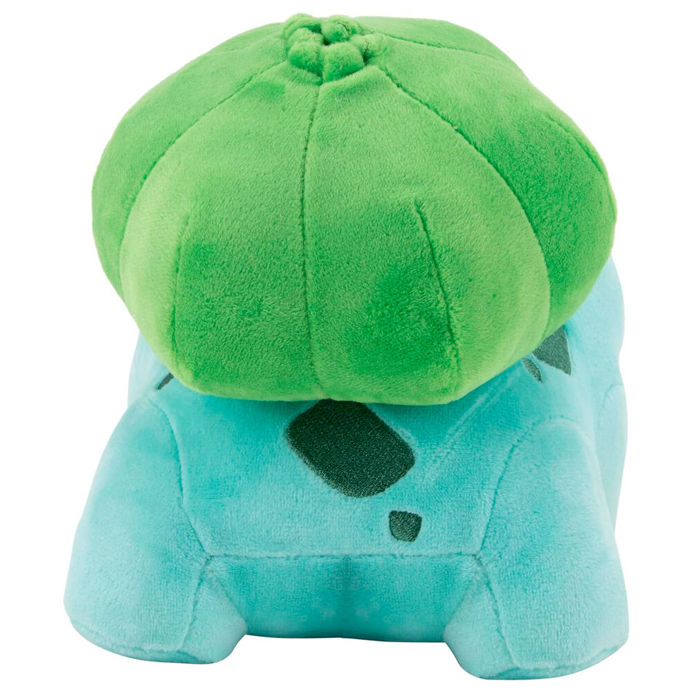 Peluche Bulbizarre Pokémon tenue dans une main pour montrer sa taille compacte