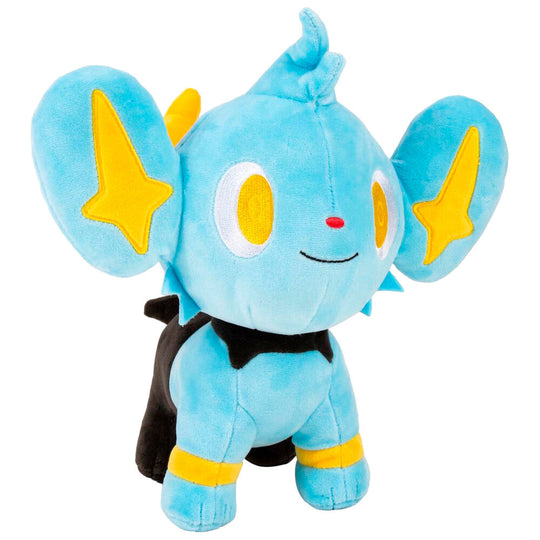 Gros plan sur la tête de la peluche Shinx montrant ses yeux lumineux et oreilles pointues